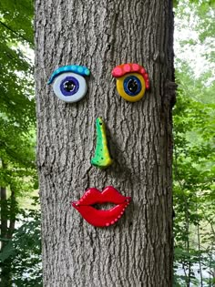 a tree with a face painted on it