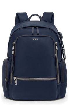 This travel-ready backpack features a handy Add-A-Bag sleeve for sliding onto suitcases along with a durable nylon design and well-organized interior. Top carry handle; adjustable backpack straps Two-way top-zip closure Exterior front zip pockets; side zip pocket; back smartphone pocket; back luggage sleeve Interior zip pockets; padded laptop pocket Nylon/leather Imported This bag includes Tumi Tracer®, an exclusive, complimentary program that helps reunite lost or stolen bags with their rightfu Nylon Luggage For On-the-go, Nylon Luggage With Zipper Closure For On-the-go, Modern Nylon Travel Bag With Zipper, Modern Nylon Travel Bag With Zipper Closure, Business Nylon Luggage With Zipper Closure, Nylon Travel Bag With Zipper Pocket For Commuting, Versatile Nylon Business Luggage, Nylon Bags With Zipper Pocket For Business Trips, Modern Nylon Luggage With Zipper