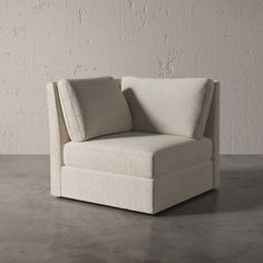 a white chair sitting on top of a cement floor