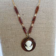 "Handmade Celluloid Cameo Gold Metal Necklace. Repurposed Old Broken Cameo Necklace With Celluloid Chain Additions. This Lovely Piece Can Continue to be Enjoyed as a Remade Piece. Brown Marbleized Celluloid Cameo PENDANT on Accented Chain. Extra O Rings Added to Adjust the Necklace Length. This Old Costume Jewelry Cameo Necklace is in good shape for its age. Size: 2\" Circle Celluloid With Oval 1 1/4\" X 1 5/8\" Cameo, 32\" Accented Chain For other handmade, jewelry and vintage items see: www.Ve Antique Brown Necklace For Collectors, Vintage Gold Resin Jewelry, Handmade Retro Brown Necklaces, Retro Handmade Brown Necklaces, Retro Brown Handmade Necklaces, Vintage Handmade Amber Necklace, Handmade Vintage Amber Necklace, Handmade Vintage Resin Jewelry, Handmade Retro Resin Jewelry