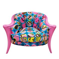 an upholstered pink chair with blue and pink designs on the back, sitting in front of a white background