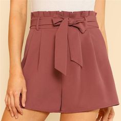 These pleated shorts are absolutely perfect. Featuring a high waist with a sash belt and zippered front. These shorts pair perfectly with a bodysuit or cropped top so be sure and visit our Bodysuits and Tops Collections to complete your look. Made with a blend of polyester and spandex for comfort and style. Como Fazer Short, Highwaist Shorts, Shorts Design, Tie Waist Shorts, Rock Outfit, Plain Shorts, Women Shorts, Elegant Skirt, Pleated Shorts