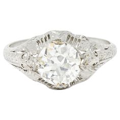 an old cut diamond ring with filigrees