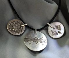 Three ancient Kabyle ethnic pendants to be mounted on necklaces, in solid silver with coral beads. I still have others of the same kind but different on my shop, you can visit it. **Height: ✓* large pendant: 4 cm. ✓* small pendants: 3 cm. **Width: ✓* large pendant: 3.5 cm. ✓* small pendants: 2.5 cm. **Material: sterling silver, real coral. **Total weight: 38.7 grams. **Origin: Region of the Great Kabyle 1980s - Algeria. **Free shipping worldwide by DHL. I am always open to offers for one of my i Artisan Silver Beads Pendant Necklace, Artisan Silver Bead Pendant Necklace, Artisan Silver Beaded Pendant Necklace, Artisan Antique Silver Pendant Necklace, Artisan Pendant Necklace In Antique Silver, Artisan Etched Pendant Necklaces, Bohemian Etched Antique Silver Necklace, Unique Silver Necklace With Coin Pendant, Artisan Silver Necklace With Coin Pendant