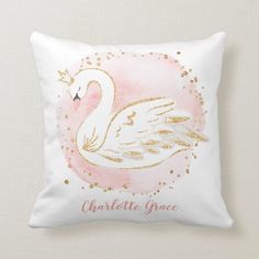 a pink and gold swan pillow with the words charlotte grace on it's side