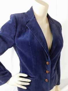 "Vintage 70s ladies blue corduroy fitted blazer with suede elbow patches and leather buttons. A sweet little blazer jacket you can pair with jeans or a boho skirt.  Classic Italian style lapels, a welt chest pocket, and side pockets. 3  leather buttons on the front and sleeves. Detailed with curved seaming and front pockets. Tage reads J Jordan size 11  12. Please refer to measurements. Measured flat Shoulders 15\" Sleeve 23\" Underarms 18\" Hips 18\" Length 23\"" Winter Fitted Blazer With Pockets, Fitted Winter Blazer With Pockets, Fitted Single Breasted Button-up Blazer, Spring Fitted Blazer With Button Cuffs, Fitted Blazer With Button Cuffs For Spring, Casual Fitted Single-breasted Blazer, Fitted Cotton Button-up Blazer, Fitted Button-up Blazer With Button Closure, Fitted Long Sleeve Blazer With Buttons