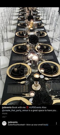 a long table set with black and gold place settings for an event or special occasion