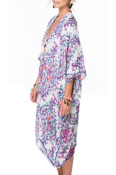 Bright, watercolor prints bring vivid contrast to this airy Kimono style from Pool to Party. Great paired with shorts or jeans or can be poolside ready. Vacay here we come. Modal/Viscose Luxury Blend One Size, Loose and Easy Shape Made in USA from fabric from India Printed Summer Cover-up For Day Out, Summer Patterned Kimono For Beach Cover-up, Summer Beach Cover-up Kimono, Vacation Beach Cover-up Kimono With Kimono Sleeves, Beachy Multicolor V-neck Cover-up, Casual Patterned Kimono For Beach Cover-up, V-neck Summer Cover-up For Spring, Floral Print Open Front Cover-up For Vacation, Beachy Boho Print Cover-up For Vacation