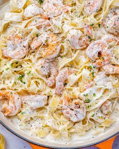 pasta with shrimp and parmesan cheese in a skillet