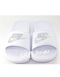 "Swarovski Nike Slide Sandals Custom Hand Jeweled with Genuine Swarovski Crystals ✨ by Jezelle Designs! A favorite of athletes for pre and post workouts! 💖AND the PERFECT GIFT for HER, the sparkle-lover in your life! 💖 💎Custom hand jeweled with genuine Swarovski Crystals, these Nike Benassi JDI Sliders are easy to slip on and super comfortable. Whether you're wearing them to the pool, around the house, to run errands, or pairing them up with your athletic gear, they're the perfect all year ro Nike Slides Womens, Nike Slide Sandals, Nike Benassi Slides, Bling Nike, Bling Nike Shoes, Swarovski Nike, Ig Bio, Bling Sandals, Nike Sandals