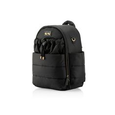 a black backpack with gold hardwares on the front and side pockets, sitting against a white background