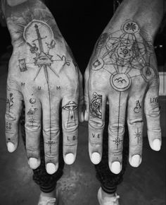 two hands with different tattoos on them, one has a compass and the other has a clock