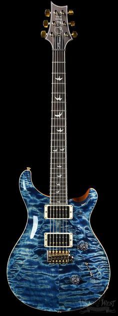 an electric guitar with blue paint on it