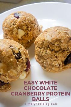 three cookies on a plate with the words easy white chocolate cranberry protein balls