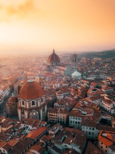 an aerial view of a city at sunset