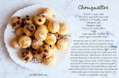 a white plate topped with cookies covered in powdered sugar on top of a table