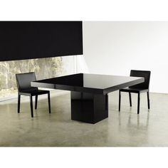 a black table and chairs in a room