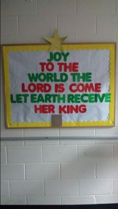 a bulletin board with the words joy to the world, the lord is come let earth receive her king