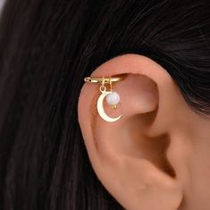 Helix gold hoop earring with a gold moon charm and Moonstone bead. The charms on this helix hoop piercing are detachable which is great because they can be worn together or separately. Huggie Hoop - surgical stainless steel gold plated (18 gauge) Charm - sterling silver 925 gold plated Shipped with tracking number Helix Charm Earring, Gold Moon Cartilage Earrings, Gold Moon Shaped Cartilage Earrings, Gold Round Cartilage Earrings With Moon Charm, Helix Hoop Earring With Charm, Gold Moon-shaped Cartilage Earrings, Opal Helix Earrings, Helix Piercings, Helix Ring