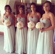 the bridesmaids are all dressed in white dresses