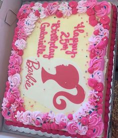 a pink and white birthday cake in a box