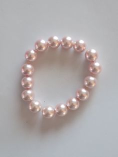 This super pretty pearl bracelet is perfect for a gift. This lightweight and comfy bracelet measures 7"on stretch cording.  This comes with a gift 🎁 bag. Pink Pearl Bracelet, Pink Pearl, Jewellery Collection, Pearl Bracelet, Gift Bag, Jewelry Collection, Jewelry Bracelets, Etsy Accessories, Handmade Jewelry