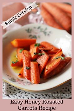 a white plate topped with carrots on top of a table