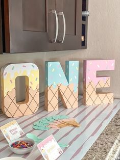 the letters are made out of ice cream and sprinkles, along with other decorations