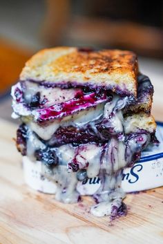 a grilled cheese and blueberry sandwich on a plate