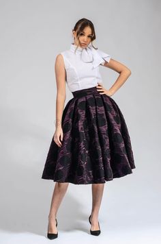 This brocade velvet circle skirt is a must-have for any woman's wardrobe. It's made from 100% brocade, so it's both soft and elegant. The skirt has a high waist and a full circle skirt, which gives it a flattering and feminine look. The skirt is also lined, so it's comfortable to wear. This skirt is perfect for any occasion, from a night out to a special event. It can be dressed up or down, depending on the occasion. The skirt is versatile and can be paired with a variety of tops and accessories Chic A-line Skirt For Party, A-line Pleated Maxi Skirt For Party, Elegant Knee-length Pleated Skirt For Party, Elegant Full Pleated Skirt With Ruffles, Party Skirt With Ruffles In Midi Length, Flared Party Skirt With Ruffles, Party Season Midi-length Skirt, Party Flared Pleated Skirt With Ruffles, Flared Ruffle Skirt For Party