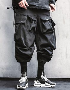 Multi Pocket Cargo Pants Baggy Techwear Parachute Pants For Outdoor, Techwear Baggy Parachute Pants For Outdoor, Techwear Parachute Pants For Outdoor Activities, Baggy Combat Cargo Pants For Outdoor Activities, Techwear Pants With Pockets For Outdoor Activities, Urban Style Baggy Cargo Pants With Functional Pockets, Baggy Combat Cargo Pants For Outdoor, Combat Style Cotton Trousers, Combat Cotton Trousers