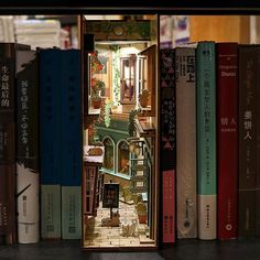 an open book case with books on top of it in front of a shelf full of books