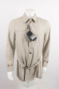 Massimo Dutti Men's Classic Cotton Trench Coat Jacket Large  Beige sand khaki colored  3412/086 Trench coat with belt detail.  Features a tailored fit, a Kent collar, undercollar with buttoned tab, front button-up fastening, two side pockets with hidden snap buttons,  long sleeves with a buttoned tab on each cuff, a storm flap, a back vent with snap-button fastening, belt loops, lining and several inside pockets.  New With Tags down the back - 37" pit to pit - 20" sleeve - 25.5" Beige Gabardine Outerwear With Pockets, Beige Gabardine Notch Lapel Outerwear, Massimo Dutti Trench Coat, Double-breasted Gabardine Outerwear With Concealed Placket, Gabardine Button-up Outerwear With Hidden Button Closure, Cotton Trench Coat, Coat With Belt, Khaki Color, Massimo Dutti