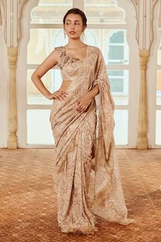 Brown saree with paisley print and scallop and ruffle edged detailing. Paired with coordinating blouse and floral, pearls, beads, stones, tassels and sequins embroidery. - Aza Fashions Elegant Brocade Pre-draped Saree For Designer Wear, Brocade Pre-draped Saree With Resham Embroidery, Bollywood Style Brocade Pre-draped Saree For Designer Wear, Eid Cotton Silk Pre-draped Saree, Fitted Pre-draped Cotton Silk Saree With Resham Embroidery, Fitted Draped Blouse Piece For Eid, Elegant Draped Chanderi Saree, Brocade Pre-draped Saree For Reception, Eid Draped Blouse Piece With Pallu