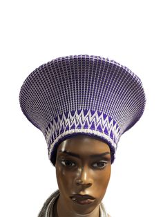 This is the perfect hat for your occasions. The Zulu Basket Hat-No Beading is made of hand-woven natural fibers with a reinforced brim to ensure long-lasting wear. Its classic Zulu shape and style make it a timeless choice that will never go out of style. With no added beading, this hat offers a clean look and bold sophistication. Is a Traditional South African headpiece that is curated from South Africa To get the right fit, measure the circumference of your head African Headpiece, Zulu Hat, Basket Hat, Zulu, Purple And White, South African, Go Out, Out Of Style, Natural Fibers