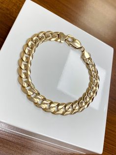 9ct Solid Yellow Gold Gents Curb Bracelet  Weight: 23.37 Grams  Length: 8 Inch Width: 10mm Sale Price: £1215.00 All articles come presented in a gift box Elegant Sterling Silver Cuban Link Bracelet For Formal, Luxury 14k Gold Bracelet With Curb Chain, Luxury 14k Gold Bracelets With Curb Chain, Luxury White Gold Bracelet With Curb Chain, Classic Cuban Link Bracelet As Gift, Luxury White Gold Curb Chain Bracelet, Classic Sterling Silver Curb Chain Bracelet, Luxury Sterling Silver Cuban Link Bracelet For Formal Occasions, Elegant Cuban Link Bracelets For Anniversary