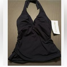 Nwt Athleta Swim Halter Shirred Black Shirred Top Size Xs Nwt! Flattering Swim Halter Bathing Top That Has A Tie Closure Around The Neck. Very Stretchy For A Comfortable Fit. The Sides Are Shirred. There Is A Band Below The Bust And V-Neckline. Removable Cups. -75% Nylon -25% Lycra Spandex Fitted Go-dry Racerback Top, Sporty Stretch Halter Neck Top, Fitted Halter Neck Athleisure Top, Sporty Solid Halter Neck Tank Top, Casual Halter Neck Sports Top, Solid Halter Neck Sports Tank Top, Casual Halter Neck Swimwear For Sports, Solid Halter Neck Tank Top For Sports, Athleisure Halter Neck Gym Top