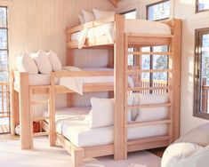 bunk beds with white pillows in a room