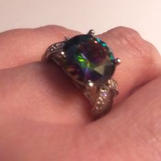 This Stunning Edwardian Victorian Vintage Mid-Century Avant-Garde Bohemian Gothic Celtic Style Ring Is A Show Stopper. 925 Sterling Silver. Size 8 4 Carats Of Mystic Topaz Stones. 2 Carats Of White Topaz Stones. Mystic Topaz Is Also Known As Fire Topaz, Mystic Fire Topaz, Alaskan Ice And Rainbow Topaz. ... Topaz Is Said To Promote The Successful Completion Of Endeavours; It Also Improves Relationships Through Better Quality And Clarity Of Communication And Understanding. 100% Authentic Stones, 9 Mystic Fire Topaz, Rainbow Topaz, Mystic Topaz Ring, Smokey Topaz, Turquoise Bracelet Cuff, Purple Band, Mystic Topaz, Original Jewelry, Topaz Stone