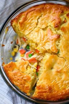 a close up of a pie on a plate with a piece missing from the pie