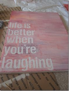 a piece of wood with the words life is better when you're laughing on it