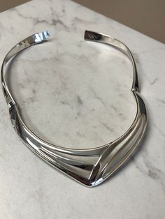 "A Beautiful Classic Sterling Silver Large Solid Bracelet and Necklace Set. The Bracelet is very solid and well-made with two hinges and a hidden clasp. The inside opening dimension is 2 1/4\". The wide is 1 1/8\" and graduated down to 5/8\" in the back. The Necklace is also solid and well-made with double hinges to open with a hidden clasp. This choker would fit for a 16\" neckline. Both of these open design pattern has a bright shiny plain polish finish. This is only sold as a set. This item w Heart Band, Bracelet And Necklace, Choker Necklace Set, Metal Necklace, Open Design, Metal Necklaces, Gold Hoop, Mens Wedding Bands, Gold Hoop Earrings