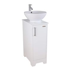 a white sink sitting next to a cabinet with a faucet on top of it