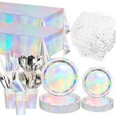 holographic plates, silverware and napkins are arranged on a white background