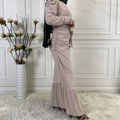 Our decadent Long Sleeve Ruffled Maxi Party Dress is a stylish yet modest statement of fashion. Featuring puffed, gathered sleeves, an elegant high neck, a thick waist tie, and a long skirt with a ruffled hem, this luxurious piece is the perfect choice for all your most fabulous events. Belted Stretch Dresses For Spring, Spring Stretch Belted Dresses, Beige Belted Party Dress, Beige Belted Dress For Party, Fitted Belted Long Sleeve Dress For Spring, Fitted Beige Belted Dress, Modest Fitted Maxi Dress With Ruffle Hem, Fitted Maxi Dress With Ruffle Hem And Long Sleeves, Fitted Beige Dress With Ruffle Hem