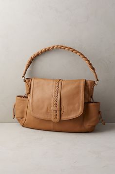 A unique braided handle showcases the suppleness of South American leather and lends a subtle statement to this thoughtfully organized convertible hobo bag. Two usable styles in one sleek design, the Horizon a provides plenty of storage day-to-night. Boho Leather Bags, Wool Coats, Bag Ideas, American Southwest, American Leather, South American, The Horizon, Hobo Bag, Crossbody Shoulder Bag