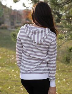 Cuddle up and go out and in your one and only striped Sweatshirt. The cozy pullover has the cutest details! The sweatshirt features your favorite hood and pockets, I could live in it! Model is wearing a Small. True to size, standard fit Material 95% Polyester 5% Elastane Measurements 25" Long 20" Chest Shipping & Returns Click here to learn more about Shipping and Processing Click here to read our Return Policy Casual Striped Hoodie With Ribbed Cuffs, Striped Cotton Sweatshirt With Drawstring Hood, Striped Hooded Tops For Fall, Striped Sporty Hoodie With Drawstring, Casual Striped Hooded Top, Sporty Striped Hoodie With Drawstring, Casual Striped Hoodie With Drawstring Hood, Casual Striped Loungewear Sweatshirt, Casual Striped Sweatshirt For Loungewear