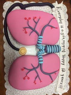 a cake decorated to look like a heart and kidney with a stethoscope on it