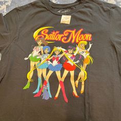 Brand New With Tags Sailor Moon Tee Shirt 100% Cotton Black Size Large Tied T Shirt, Womens Golf Shirts, White Short Sleeve Tops, Nike Tennis Dress, Thermal Shirt, Pink Adidas, Mama Shirt, Golf Shirts, American Apparel