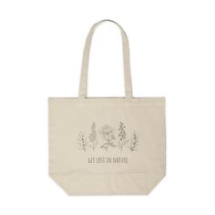 a tote bag with flowers and the words get lost in nature printed on it